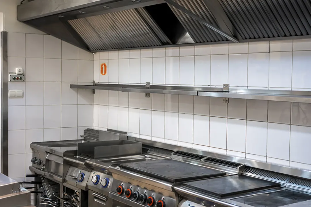 Satisfied restaurant owner with Salt Lake City Hood Cleaning technician